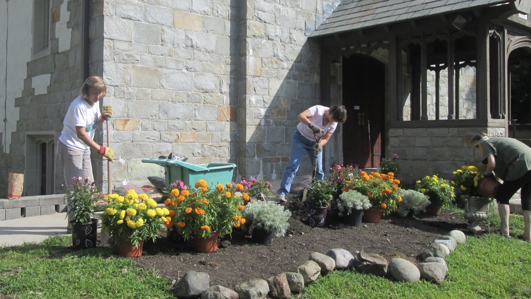 Members building gardens on church grounds 